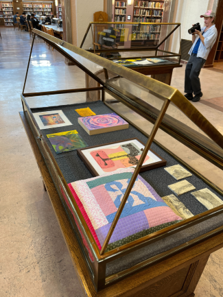 Art displayed in an open glass case