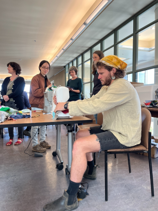 An artist using a sewing machine