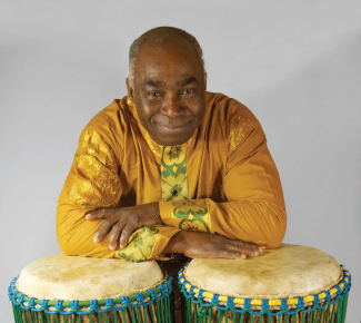 photo of musician Onye Onyemaechi with 2 drums