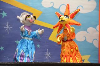 photo of puppets representing the human form of the moon and the sun