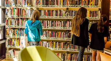 Teens browsing shelves at North Branch.
