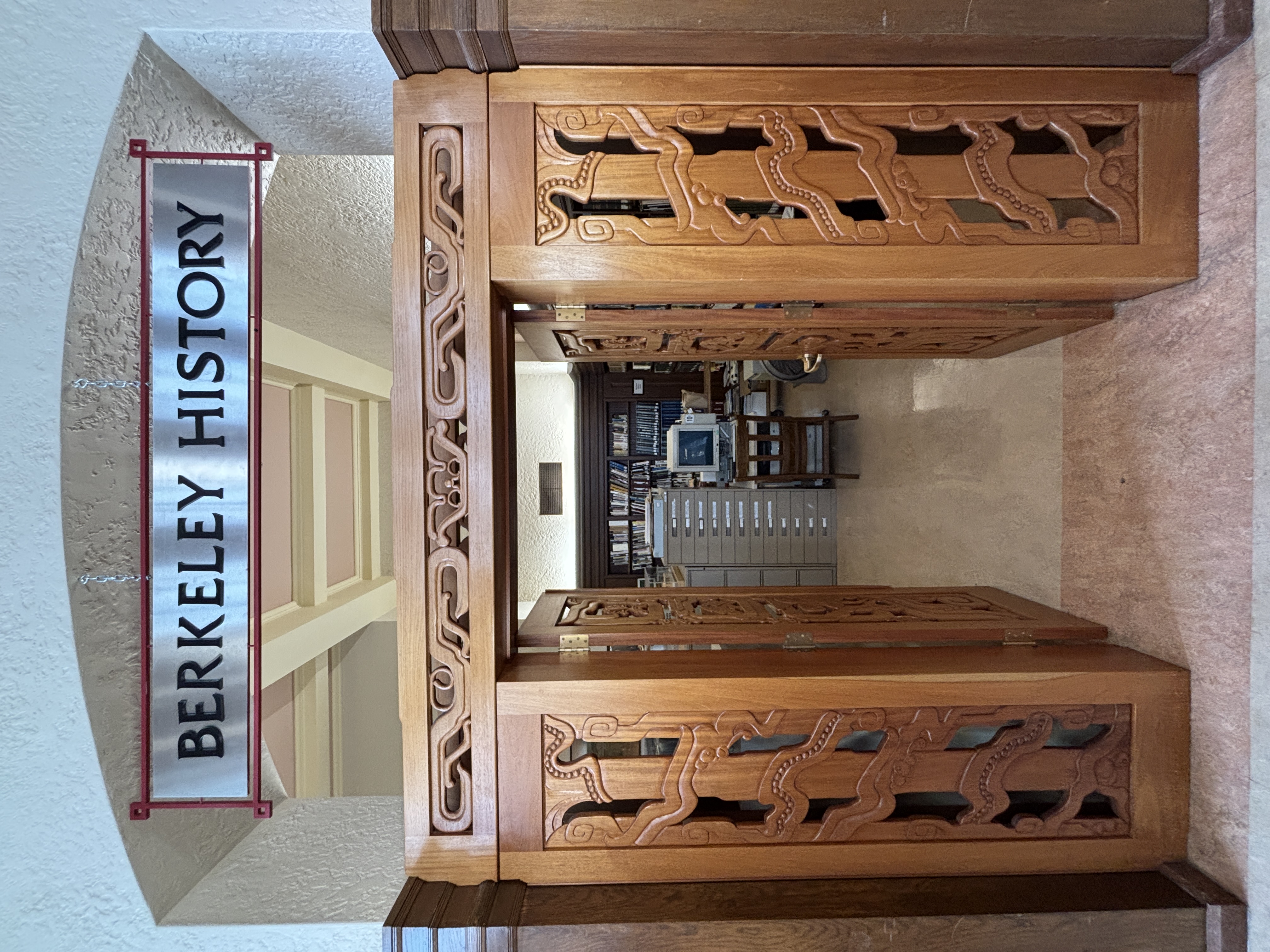 Wooden doors open to the Berkeley History Room