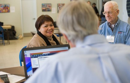 photo of AARP tax aide giving assistance to clients