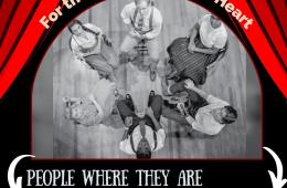 A red theater curtain is open to reveal a black and white image viewed from above of students and teachers sitting in a circle looking up. 