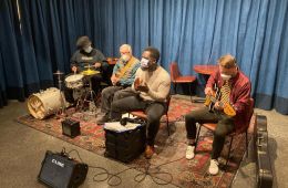 Four members of the Story Time Band playing instruments