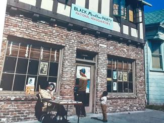 photo of two women in the 1960s or 1970s outside the Black Panther Headquarters storefront