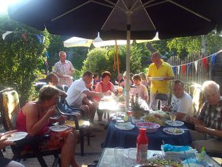 A family enjoying eating outdoors