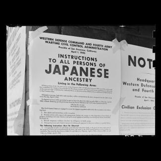 Black and white photograph of WWII-era notice of relocation of Japanese Americans