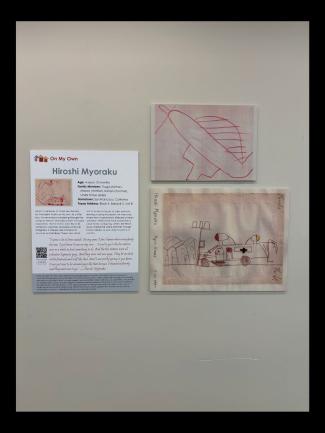 Children's drawings and text panel on large posterboard