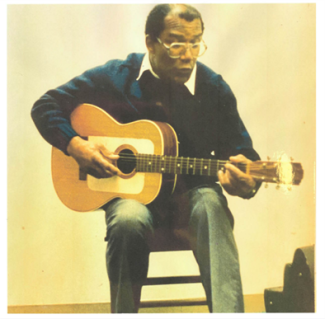 Jim Jacobs playing guitar