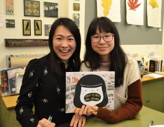 Vivienne and Eugenia holding their book