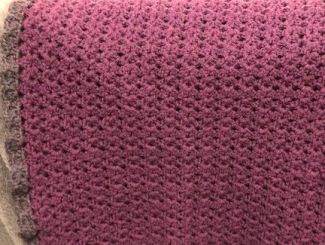 Crocheted purple and grey baby blanket