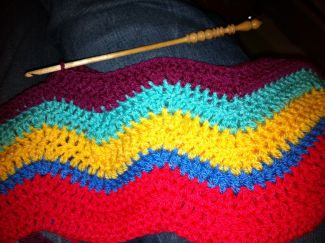 Multi colored crochet blanket - This Photo by unknown author is licensed under CC BY-NC-ND