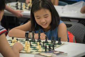 Girl learning Chess
