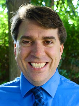 Jeff Scott, new Library director smiles at camera