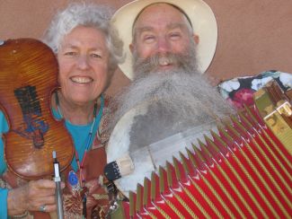photo of Jeanie McLaren and Ken Keppeler holding various instruments