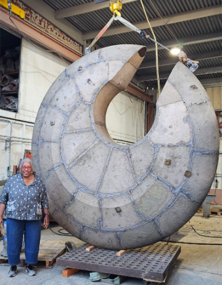 Mildred Howard with circular art scuplture