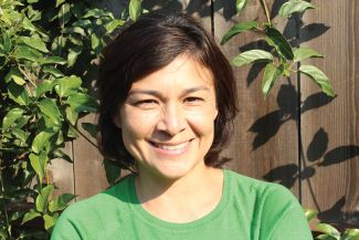 Journalist Monica Campbell in green shirt. 