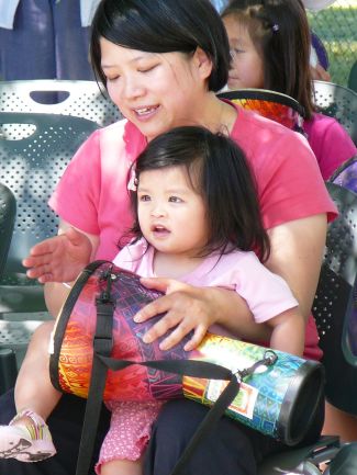 photo of mom and daughter playing djembe