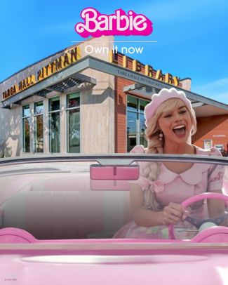 Image of Barbie driving in her Corvette in front of the library, the word "Barbie" in pink at the top
