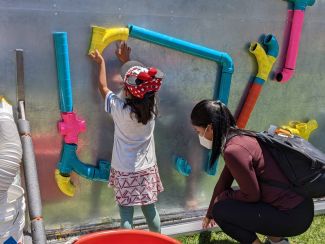 photo of kids at interactive outdoor exhibit