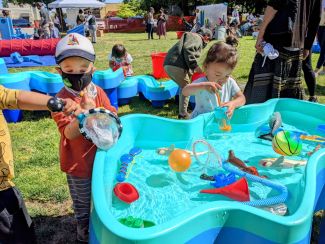 photo of kids outdoors playing in waterworks water play exhibit