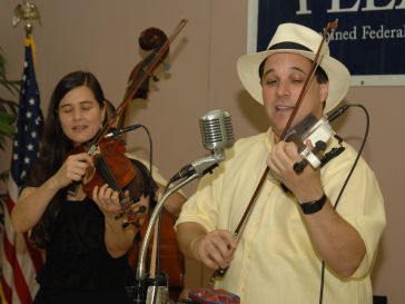 Musicians playing in the HUD Hispanic Heritage Month Program - HUD Hispanic Heritage Month closing program: musical performance