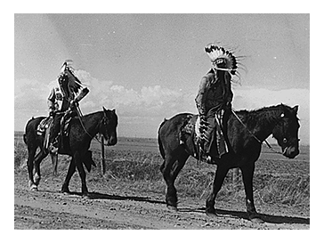 Historic photograph of two horseback riders