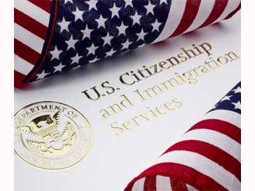 Citizenship and Immigration Services seal with USA flags
