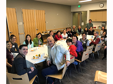a room full of people enjoying a meal